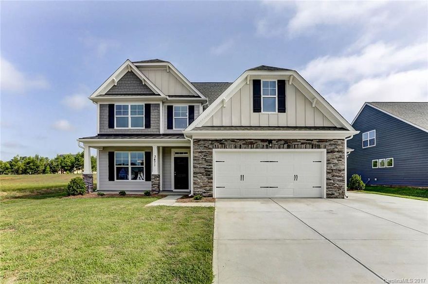 A gorgeous master down plan with tons of living space, bonus room, additional utility garage, and covered porch! Upgraded light & plumbing fixtures, carriage style garage door, interior trim package with 2-tone designer paint, iron rail & pickets and upgraded flooring!  Designer Kitchen includes upgraded maple cabinets & hardware, crown molding, quartz countertops with ceramic tile backsplash, recessed lighting and stainless appliances!  Come see this beautiful home today!