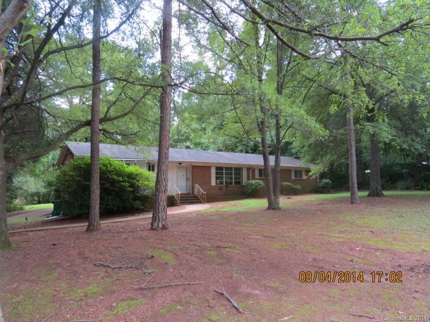 Ranch home with a full basement on a large wooded lot in the Steeleberry Acres subdivision. Country setting yet a short distance to I-485, I-85 and the airport. Shopping nearby in the fast growing I-485/HWY 160 area. AC currently not working. City sewer is currently not available.     DO NOT CALL CSS! Upon receipt of signed disclosure, agent will call showing agent with code to show property.