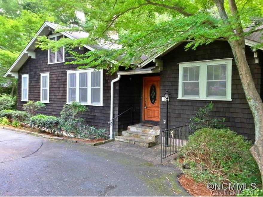 Quiet, Tryon living. This  Beautiful Craftsman style house has incredible charm and personality. Recent addition to this house includes a spacious kitchen and great room complete with cathedral ceiling and  gas logs. This property has  Incredible curb appeal with well manicured beds and a water feature that includes a lily pond. Large screened porch and deck overlook a quite and peaceful back yard.This house is private but minutes from downtown