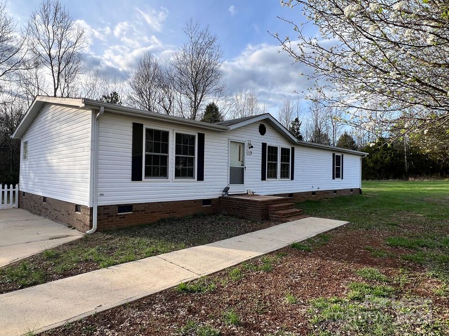 Well maintained RANCH home on just over a half an acre lot with a serene country setting in Iredell County! The open and split floor plan has Living Room at Entry, open Kitchen with island and stainless appliances and a spacious Dining/Family Room area. The Primary Bedroom Suite has a walk-in closet, separate shower and garden tub! There are also 2 Bedrooms that share a 2nd Full Bathroom, and the Laundry Room with Washer/Dryer included and access to the Rear Deck. Outdoor amenities include a partially Fenced backyard, Storage Shed and Driveway that will accommodate 3 vehicles (No RV's or large Trailers allowed). The fireplace is for decoration only and cannot be used. Tenant is responsible for all utilities, garbage pickup and lawn maintenance. No Smoking and 2 Pets are conditional with a non-refundable pet fee. AVAILABLE NOW!