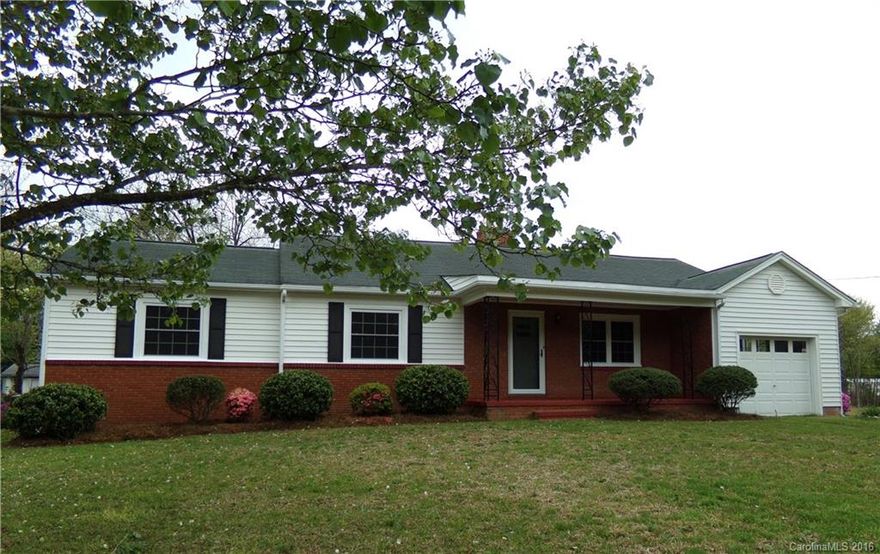 This immaculate, charming, move in ready home on a huge corner lot is ready. Shiny hardwood floors throughout highlight all new paint. A large living room features a lovely fireplace. A dining room adjacent to the spacious kitchen with pantry leads to a wonderful rear sun porch. Two of the three bedrooms have easy access to the full hall bath with ceramic tile. The master bedroom and bath have private rear entry. All new windows compliment low maintenance vinyl and brick. CH&A. Don't miss it!