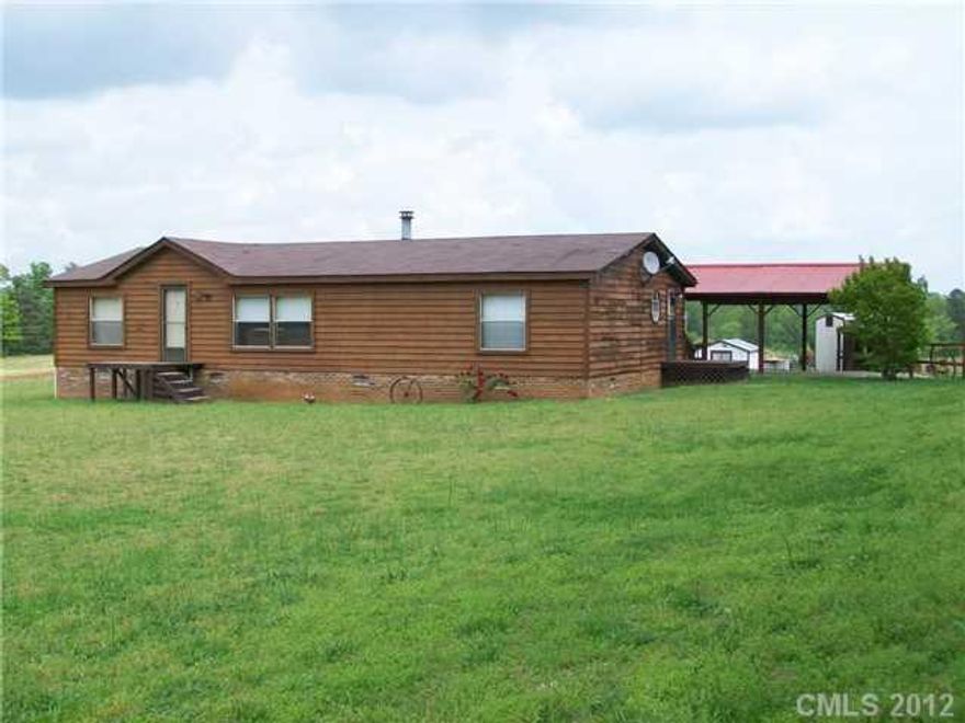 Rustic cedar siding, all appliances remain. On 4.6 acres with large double garage/workshop plus storage building. Steel yard ornaments/wheels do not remain. HOUSE IS  LEASED & WITHDRAWN FROM MARKET.