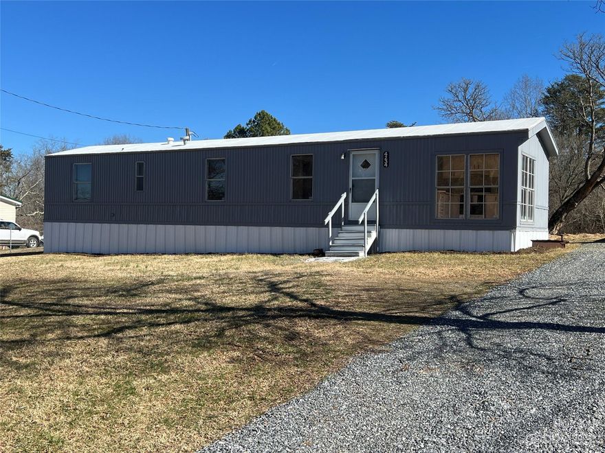 Back on Market at no fault of the home! Perfect investment property!  Two bedrooms, one bath manufactured home on a beautiful level lot.  With updated central air, new flooring, and paint on the interior and exterior, a new seal coated roof and a nice gravel driveway.  This property is just minutes from the Maiden Recreation Center and the to be built Maiden Elementary School.  Don't miss out on this property, it will go fast! Cash purchase and proof of funds required with offer.  Buyer's agent and/or buyer to verify all property data, not limited to, utilities, deed, and any easements during due diligence. Sold As-Is.
