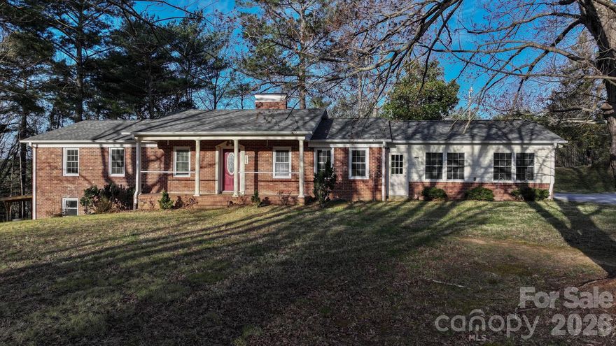 Immaculate, move-in ready, and full of thoughtful updates—this beautifully maintained brick home offers the perfect blend of comfort, space, and location. Enjoy the ease of one-level living with the added bonus of a full basement for future expansion or recreation.

Step through the front door into a welcoming foyer that opens into a classic living room, setting the tone for this well-designed home. Throughout, you’ll notice an abundance of storage—one of the many features that sets this property apart. The main level includes three spacious bedrooms and two full bathrooms, including a private primary suite.

At the heart of the home, the dining area flows seamlessly into an updated kitchen featuring granite countertops, stainless steel appliances, and a layout ideal for both everyday living and entertaining.

Just off the kitchen is the true showstopper—a fully enclosed, permitted 23x24 space (over 560 square feet) that was once a carport and is now a stunning, open gathering area. Whether hosting friends, creating a game room, or enjoying additional living space, this versatile area offers endless possibilities.

Downstairs, the full basement with fireplace provides even more room to spread out, with potential for additional finished square footage, a workshop, or storage.

Outside, enjoy a back patio overlooking a level half-acre lot—perfect for gardening, play, or simply relaxing.

Conveniently located adjacent to Table Rock Middle School, just minutes from downtown Morganton’s shops, dining, and entertainment, and only a short drive to Lake James and the outdoor adventures of Western North Carolina—this home truly has it all.