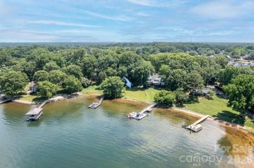 Beautiful waterfront lot on Lake Norman! Wonderful location off Sam Furr Rd. (Exit 25) Close to Birkdale Village, shopping, schools, waterfront parks, and restaurants. Rare .8-acre lot with year-round water views! Beautiful 100-year-old trees on property.