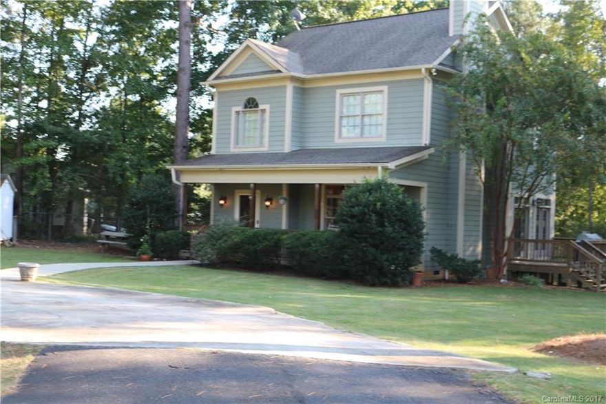 You will be amazed upon entering this beautifully maintained custom home. Foyer is flanked w/ a beautiful & impressive staircase. Great room features columns & a stunning stacked stone fireplace w/ gas logs, built-in cabinetry & a gorgeous coffered ceiling. The gourmet kitchen boasts granite countertops, tile backsplash & stainless  appliances. Enjoy your morning coffee on the deck or on your spacious rocking chair front porch. You will feel like you have stepped into a model home! Welcome Home!