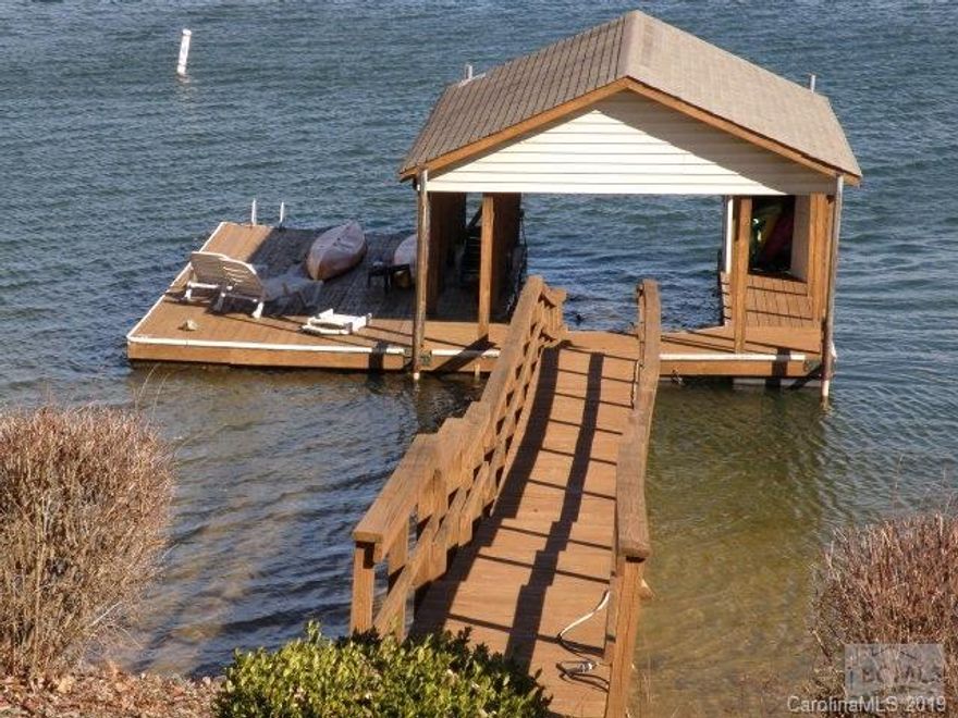 Big water views of Lake James. Lot 15 is a point lot with 331 feet of lakefrontage. 3 bedroom, 3 bath A-Frame design home. Master bedroom and bath on second floor. Great room with stone fireplace, cathedral ceiling, kitchen, dining and 2 bedrooms on the main floor. Downstairs is a large family/rec room plus 2 car garage and storage room. Entertain and enjoy the lake views from a wrap around deck, expansive patios or the private dock with swim platform.