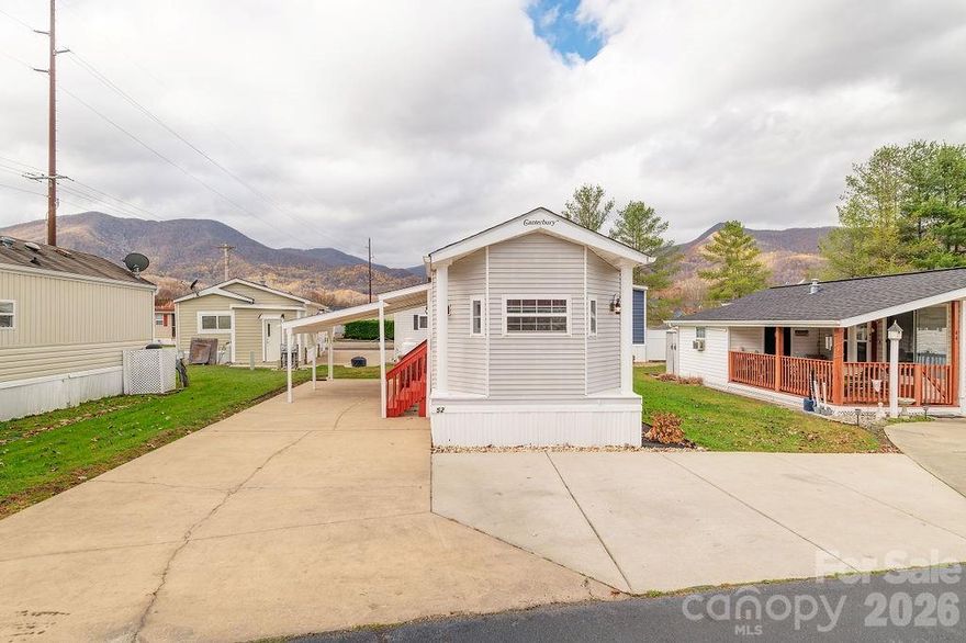 Adorable park model tiny home with beautiful year-round mountain views, located in a quiet and well-kept 55+ community where neighbors take pride in their homes and surroundings.
 Enjoy the benefit of owning your land, no lot rent, and a low HOA fee of just $100 per year. This 1 bedroom, 1 bathroom home features an open-concept kitchen and living area, perfect for easy entertaining, plus a loft space ideal for extra storage or accommodating visiting guests. The home comes fully furnished, making it truly move-in ready.
 Outside, you'll find a concrete driveway with an attached carport, along with an additional parking space. The community offers nicely paved roads, perfect for walking or biking.
 Conveniently located with easy access to I-40, and just a short drive to Maggie Valley, historic downtown Waynesville, scenic hiking trails, waterfalls, and the Cataloochee Ski Area, visible from the home during the winter months for a picturesque view.
A perfect mountain retreat or full-time residence with charm, convenience, and stunning views.  One pet is allowed. Purchase options include cash or financing through 21st Mortgage.