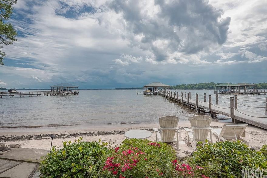 WATERFRONT ON LAKE NORMAN! FOREVER VIEWS OF MAIN CHANNEL! LOCATED OFF HIGHLY DESIRABLE ISLE OF PINES PENINSULA. 4BR w/Addl flex space used as Large 5th Bedroom. 5 Full Bathrooms including one off deck for outside access for the lake days. Fenced in area for dog run. Beach Area leading to Dock with Boat Slip, 2 Boat Lifts AND Jet Ski Lift. Level Yard in front and back, Lot can't be beat and Views are PRICELESS! Immaculately Maintained, Renovated Main Level & Kitchen w/Upgraded SS Appliances.