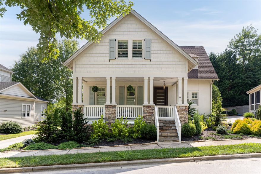 Located on an idyllic street surrounded by mature trees in a park-like setting, this home is a true Biltmore Park gem. An expansive front porch welcomes you and entices you to sit back and enjoy the tranquility. Once inside, the high ceilings, spacious rooms and open floor plan dazzle you. The elegant foyer leads to a bonus room that would make a perfect study, formal dining room or playroom.  The kitchen features a custom-designed tile backsplash, updated appliances and granite counters.  Three bedrooms upstairs and an ensuite primary bedroom on the main level allow for plenty of privacy. This home has been meticulously updated and it shows.  A short walk brings you to the bustling Biltmore Park Town Square, where you can enjoy restaurants, shopping, entertainment and fitness. Don't miss this opportunity to enjoy both the excitement of Asheville and the peacefulness of this desirable neighborhood.  Untouched by Helene and  ready for its next chapter.