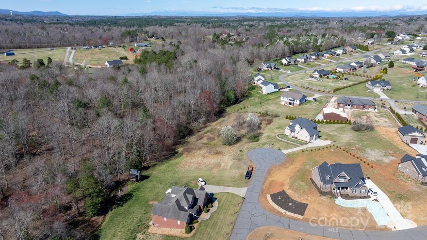 Are you looking to build a home in a beautiful gated community? Take a look at all that Antler Cove in Grace Chapel has to offer. Eight lots to choose from, some with a view of Lake Hickory. Development has a Lake side picnic area, green space and a private pond. Conveniently located across the street from the public access boat launch.