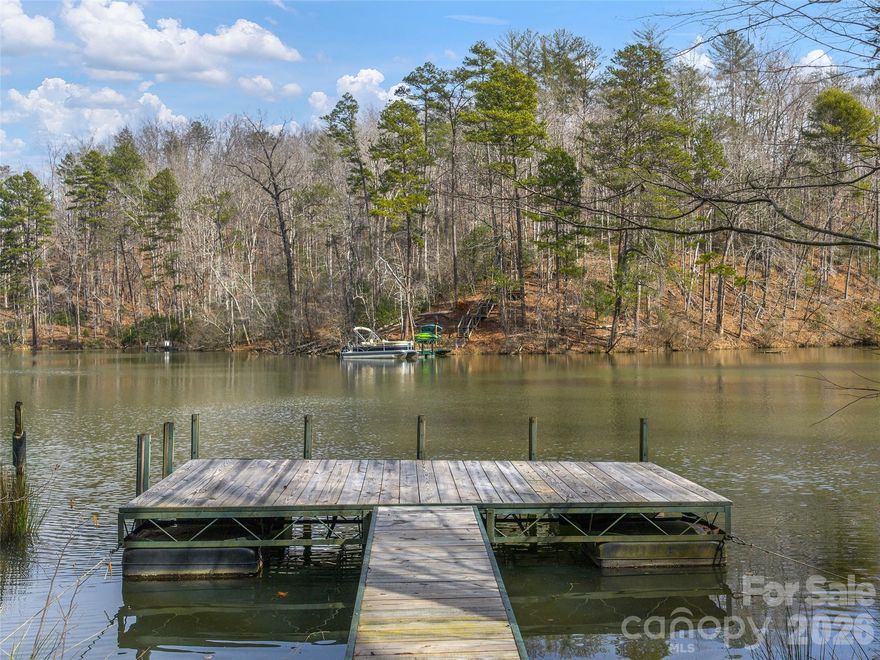 Exceptional lake front building lot on Lake Adger. This property offers the opportunity to build your home close to the water and have easy access to your boat dock and water front just steps away from your backdoor. There is already a floating dock in place for your recreational use. The property is served by an existing shared well and has previously perked for a 3 bedroom septic (expires 6/25/2026 copy on file). Lake Adger has 14 miles of shoreline and 438 surface acres of water where you can enjoy boating, kayaking, fishing and swimming. The Lake Adger Community is a private planned community with 3250 +/- acres and includes 13 miles of private equestrian and hiking trails. Conveniently located to Asheville and Hendersonville, NC and Greenville and Spartanburg, SC. Come see this lot today!