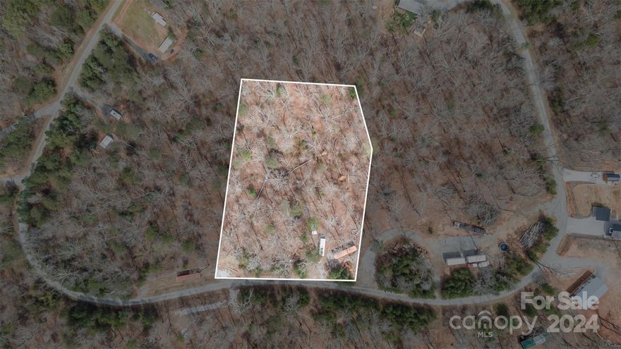 1.25 acre lot w/ gravel driveway already in place and a 40ft storage container. Property currently has hookups for 2 campers. This lot is on the outer loop of Walkaloosa Way and has tons of mature trees giving you the opportunity to build a private retreat in a great community! No timeline or size requirements for building. Horse Creek Farms has multiple walking paths around the 2 acre pond available to residents, a picnic shelter by the beach, and an additional picnic area near bridge at pond. Canoes and kayaks are available for FREE. Pond has a rope swing and play ground for kids. Utilities are underground, on public water, paved roads and streetlights. Located less than 1 hour from Black Mountain, Asheville, and Lake Lure! Community is just 10 minutes north of Chesnee, SC convenient to grocery stores, restaurants, and shopping.