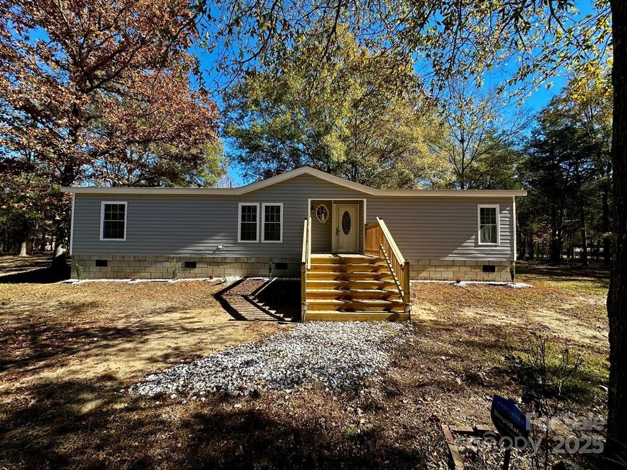 Welcome to your move-in ready home! This beautifully renovated property sits on over 1 acre, offering a perfect mix of country living and modern comfort, surrounded by nature and just 30 miles from Charlotte, 20 from Rock Hill, and 10 from Lancaster. Inside you'll find new LVP TRAFFICMASTER floors, new windows, new designer exterior doors, and a fully updated kitchen with new cabinets, granite countertops, black matte fixtures, and a touchless motion-activated kitchen faucet. Includes high-end LG stainless steel appliances: print-proof smart fridge, Wi-Fi range with AirFryer oven and Easy Clean, LG over-the-range microwave, and new dishwasher. Bathrooms fully remodeled with modern tile and black matte fixtures. Enjoy the outdoors with new front and rear wood decks. The home’s exterior features brand-new vinyl siding, great curb appeal. No HOA, no parking restrictions, plenty of space for any vehicle. Don't miss this chance to own a stylish home with land and privacy, close to everything!
Conveniently located near Fishing Creek Boat Landing, Great Falls Whitewater Park, and Landsford Canal State Park, perfect for outdoor activities.