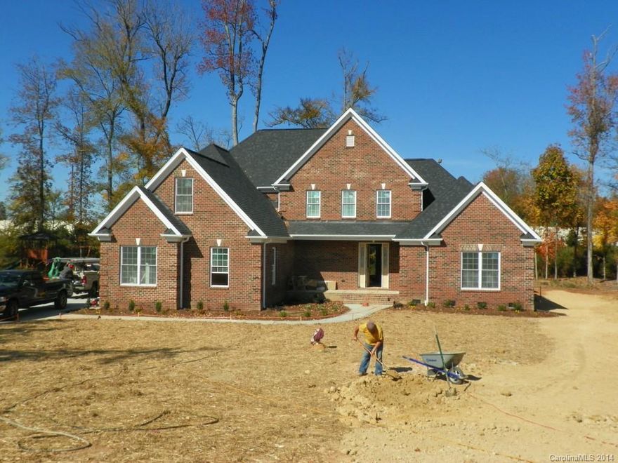 !!! OVER 4000 SQ FT (PER PLANS) ALL BRICK HOME IN HARRISBURG NEIGHBORHOOD WITH NO HOA DUES !!!  5 Bedrooms + 2 Bonus Rooms, one with a double door closet = 6 Bedrooms, Master on 1st floor.  Hardwood Floors thru-out Entire Main Level.  Granite Kitchen has island & a wall of windows in breakfast + Stainless Steel Appliances.  Great Room has Gas FP and atrium doors to deck expanding across back of house.  All Bathrooms are Granite & Tile.  Oversized Sideload 2-Car Garage.  Harrisburg Schools #1.