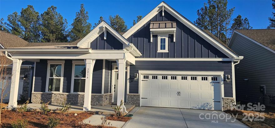 The New Cedar 1 1/2 story plan is Very Accommodating & READY NOW!  This impressive home has an inviting front porch & Popular split floorplan.  Primary bedroom is comfortably situated in the rear of the home w/walk-in closet, dual vanity & walk in shower with a built-in bench. The open concept kitchen boasts quartz counters and a gas range and is open to the dining and family room areas.    Many upgrades are included in this home such as crown molding throughout living areas and Rev Wood flooring in main living & dining areas.  All this and a Large pool & clubhouse to come; Only a few minutes to a Lake Wylie boat ramp & park. Home is connected includes programmable thermostat, Z-Wave door lock and wireless light switch, touchscreen control device, automation platform, video doorbell, and Amazon Echo pop!  Note: We now have a modern style trim package!  All features are subject to change without notice.  ASK ABOUT OUR BFC INCENTIVE (INTEREST RATE BUY DOWN WITH PREFERRED LENDER)!!!!