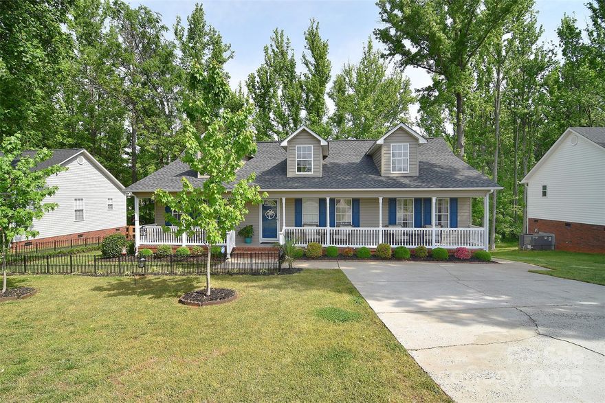 Every detail has been done! This extremely well maintained home is perfect in so many ways. For starters, enjoy the large inviting front porch with ceiling fans and new maintenance free railing.  Inside you will find 3 bed 2 bath split floorplan and NO carpet. Cheery kitchen includes freshly painted cabinets, stainless steel refrigerator, dishwasher and walk in laundry and pantry area.  Breakfast area has electric wall fireplace feature. New roof and gutters n 2024. Want to enjoy hot water quickly?.. tankless hot water heater! home also features a generator that powers 120v equipment. Large walk-in crawl space for storage. Shed has storage and power for any projects you desire. The care and maintenance that went into this yard is beyond stunning. Every picture tells a story, come see your new home for yourself!  ** tools and ALL storage units and drill holders etc in shed DO NOT remain**