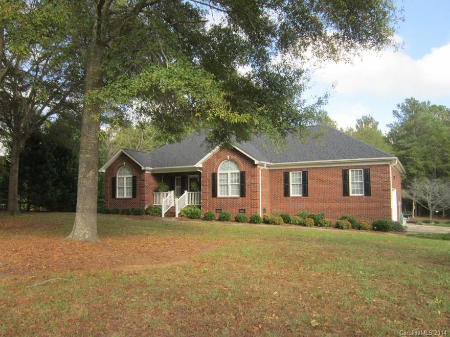 Lovely ranch on 10 wooded acres, 5 minutes to I-77. Home features foyer entry with arched openings. Formal dining, great room w/vaulted clg, FP w/gas logs. Kitchen w/custom maple cabinets, w/roll out shelves, pantry & breakfast bar. Split BR plan. Lg master suite w/tray clg, whirlpool tub. Rocking chair front porch, att. dbl garage plus detached workshop/garage w/covered area w/2 dbl sinks. Security system, water treatment system. Beautifully landscaped! Land can be subdivided.