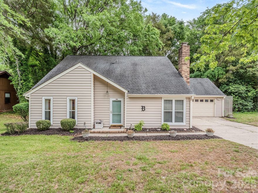 Affordable ranch + 1/2 in an established South Charlotte neighborhood with NO HOA and unbeatable convenience to shopping, parks, restaurants and I-485. This inviting home offers spacious living areas, a dramatic vaulted great room with fireplace, MAIN LEVEL PRIMARY BEDROOM and flexible secondary spaces. Enjoy the screened porch overlooking the deck and private, flat backyard with mature trees — perfect for relaxing or entertaining. A wonderful opportunity in a sought-after South Charlotte location!