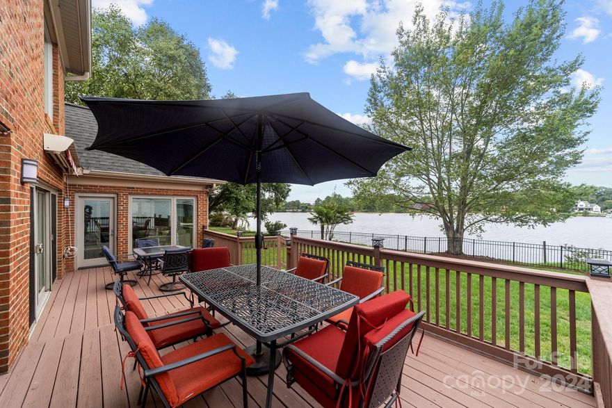 We have received multiple offers.  Sellers are asking for best and final offers by 6pm Monday August 12th.  Discover the perfect blend of tranquility and convenience with this stunning waterfront home offering breathtaking views of Lake Norman. This full-brick home is tucked away on a cul-de-sac, while also conveniently located near shopping and I-77. Enjoy the sunset from your boat or the beautifully refinished back deck, which is easily accessible from the sunroom, great room, and owner's suite. The upstairs bedroom/office is a true highlight, featuring windows that fill the space with natural light and spectacular main channel views. The versatile bonus room upstairs can serve as an additional bedroom, office, or movie room. The assigned boat slip located several houses down is included with the property, making it perfect for boating enthusiasts. Neighborhood amenities include outdoor pool, tennis/pickleball courts, and landscaping.