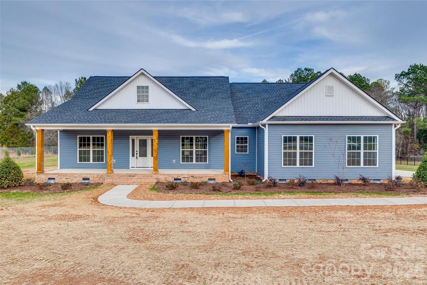 This NEW CONSTRUCION home is truly a showstopper. Set on over 2 peaceful acres, it offers generous space both inside and out. A welcoming southern-style front porch leads you into an open living and dining area that flows seamlessly into a beautiful kitchen featuring gorgeous countertops, a large island, and a spacious walk-in pantry. A sunny breakfast nook overlooks the backyard, while the separate formal dining room provides an ideal space for hosting meals and entertaining.  The large primary suite is its own retreat, complete with a stunning spa-like bath and a dreamy walk-in closet. Durable LVP flooring runs throughout the home. Two additional bedrooms offer tall ceilings, ample closet space, and share a thoughtfully designed full bath. The large laundry room is conveniently located just off the 2-car garage.  A flex space offers functional options for an office, craft space, you dream it!  Step outside to enjoy quiet mornings or relaxed evenings on the back porch, or take in the view from the charming front porch. With plenty of room to garden, play, or simply unwind, this property offers the perfect backdrop for peaceful country living.  All of this is just 15 minutes from Rock Hill and within an easy drive to Charlotte, Chester, or Lancaster. A beautiful blend of comfort, space, and convenience.