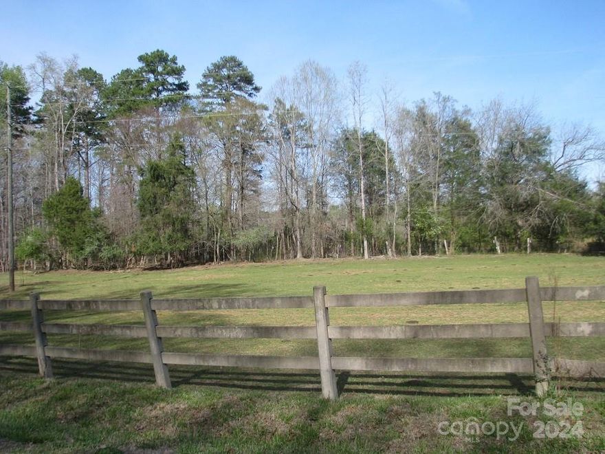 Nice Farmland near current big-city expansions at Lake Wylie area w/ short commute to Charlotte. There is 27 acres of pasture surrounded by 48 acres of mature hardwoods/pines.  There is a nice creek and stream passing through farm.  Privacy is the main word to describe this acreage at the end of Akinbac Road, a public gravel road from Hwy 274.  Some of the farm fronts on Oakridge Road and there is an old dry pond on that side of the property.