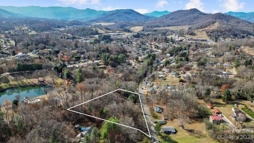 Discover the allure of a 2.6-acre wooded lot nestled within Canton's city limits, offering a unique opportunity for those seeking a harmonious balance between natural beauty and urban convenience. This property's strategic location combines the serenity of a wooded landscape with the practicality of city living. Spanning approximately 2.6 acres, the property is adorned with a diverse array of mature trees creating a natural canopy that adds to the charm of the landscape. A meandering creek traverses the property, contributing to its scenic appeal.  Within this woodland haven are several possible options for positioning a building site as an ideal location for your dream home. City water and sewer services are available. 

A bridge spans the property's small stream, enhancing the overall character of the landscape. Depending on intended use, the bridge culvert may require updating to ensure the continued functionality and aesthetic appeal of this unique feature. This is an as-is sale.