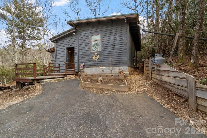 Great investment opportunity located 1 mile off the Blue Ridge Parkway, just beyond Spacious Skies Bear Den Campground. This 1 bedroom, 1 bath cabin is well on its way to completion and ready for your finishing touches, Seller is offering up to $7,000 credit toward buyer’s purchase of kitchen appliances and flooring with acceptable offer. Create the perfect cozy getaway, income-producing short-term rental, or peaceful off-grid retreat. The property backs up to over 200 acres of protected conservation land, offering abundant privacy.
Owners enjoy campground amenities including a swimming/fishing pond, playground, recreational room with pool tables, general store, scenic hiking trails, waterfall, and exceptional stargazing! Spend your evenings gathered around the fire pit making s’mores under the stars. Ideally located just minutes from the Blue Ridge Parkway, this cabin offers easy access to breathtaking views, outdoor adventures, and all the beauty the area has to offer. Whether you’re looking for a weekend escape or an investment opportunity, this property delivers the perfect blend of comfort, nature, and potential.