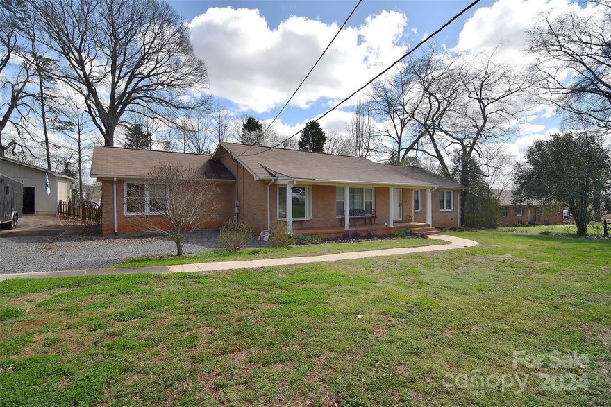 If you LOVE garage space and have been dreaming of a ranch home to make your own, look no further. This 3 bedroom/2 bathroom home offers 2 garage spaces - an attached garage with storage and a separate oversized 900 SF detached garage/workshop for all of your DIY Projects! Conveniently located near the Whitewater Center, Airport and minutes to Uptown, this beautiful home sits on almost half an acre in a quiet neighborhood. The kitchen and dining areas are large and spacious, perfect for entertaining. The large windows in the living room allow tons of natural light to fill the home. If you've been dreaming of a large mud room this home has that too. This home is sure to impress. Schedule your tour today!