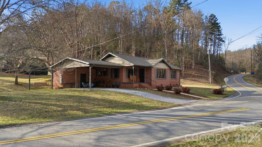 Located in the desirable and convenient Greens Creek area, this brick ranch offers one level living on a mostly level, unrestricted 1.03-acre lot just 10 minutes from the heart of downtown Sylva. The home features 3 bedrooms, 1 bath, carpet over hardwoods, comfortable layout and a cozy fireplace. You’ll also find two smaller office/flex rooms ideal for remote work, hobbies, or additional storage. Recent updates include a new roof (2022), new heat pump (2023), PEX plumbing installed under the home (Feb. 2026), and new gravel added to driveway (Feb. 2026). A nice outbuilding/workshop with power provides great space for projects or storage. You'll enjoy the sights and sounds of Greens Creek just across the street—stocked with trout twice per year. With its solid construction, recent improvements, and flexible space, this property is a great option for a starter home, downsizer, or investment opportunity. Only a small portion of the property is in the flood plain, mainly the portion across the street that abuts to Greens Creek - home itself is not. 8 mi to WCU, 52 mi to Ashville, 23 mi to Waynesvillle, Bryson City/Cherokee/Franklin all around 20 mi