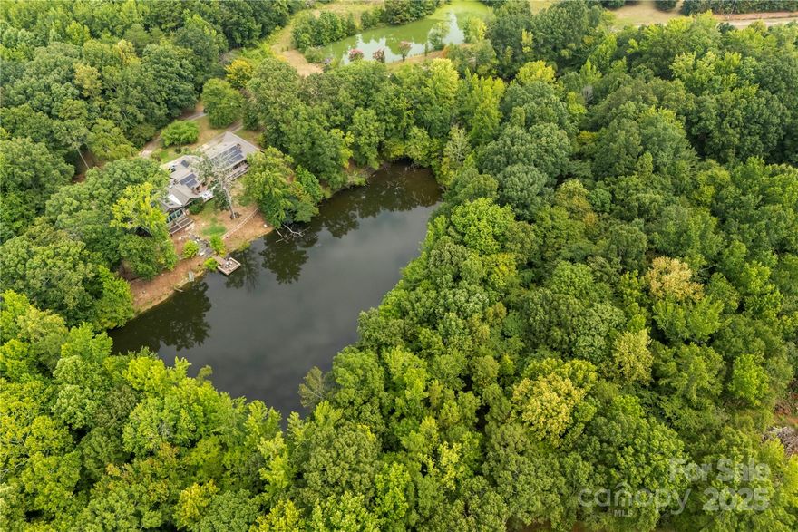 Prime development opportunity near Carowinds in Fort Mill! Spanning 16.95 acres with three ponds, this property is currently zoned RUD but offers strong potential for rezoning to unlock higher value. The site includes a 5,400-square-foot ranch home with some updates completed, providing options for redevelopment or adaptive reuse. With its strategic location near major growth corridors, this tract is ideal for investors or developers looking to capitalize on the area’s expansion. This property would also make a fabulous private estate with a gated option, offering the ultimate blend of security and seclusion.  Home is occupied.  DO NOT walk or enter property without an appointment and listing agent present.