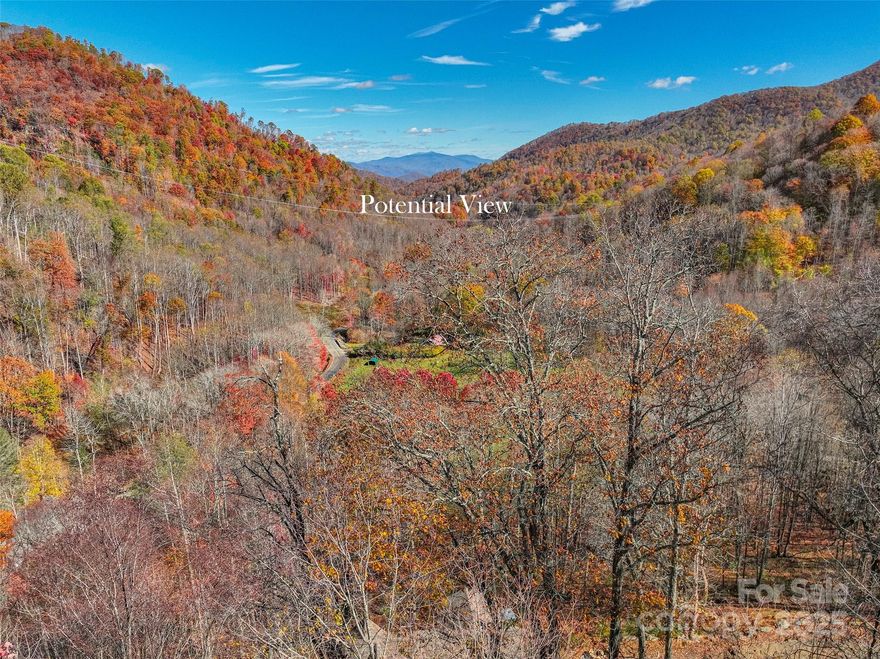 Discover the perfect canvas for your custom mountain home with this private, easily accessible 1.91 acre buildable lot. Located within the gated community of The Preserve at Wolf Laurel this homesite offers long-range mountain views from its desirable 3400' elevation. This lot is prepared with underground utilities in place and access to a community water system, simplifying the building process. The Preserve is bordered by U.S. Forest Service land, providing direct access to miles of hiking and ATV trails, including the legendary Appalachian Trail. For winter fun, you're close to the ski slopes at Hatley Pointe. Owners have the option for membership to join the exclusive Wolf Laurel Country Club, featuring an 18-hole golf course and full fitness amenities. Enjoy the best of mountain living with convenient access. Just 20 minutes to Burnsville and 45 minutes to Asheville. MUST be accompanied by a licensed agent to enter the gate for showings.