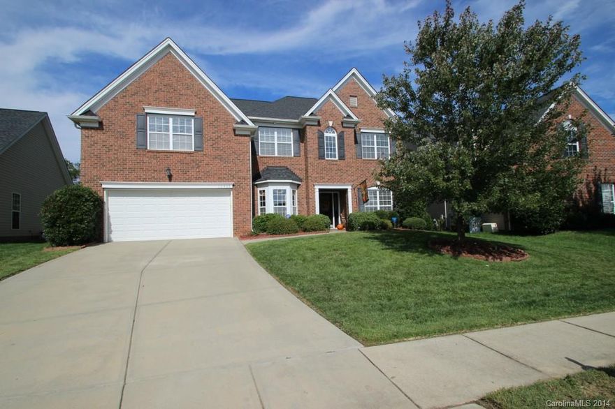 Don't miss out on this amazing home that is right across the street from the Providence Pointe Clubhouse & Pool! The home features hardwood floors, central vac, surround sound wiring, full irrigation, granite countertops, amazing custom paver patio with wood burning fireplace, fenced yard, main floor guest suite, butler's pantry, & more! Close to upscale shopping, dining, night life, and amazing Ballantyne Area Schools.  Don't delay and see this amazing home today!