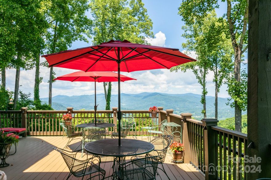 Gorgeous long range mountain views and pristine golf course views from this beautiful, spacious mountain home on three levels. Tastefully designed by architect, Armin Wessel and masterfully crafted by Tyner Construction, this legacy home is perfect for family and entertaining. You will enjoy family living on the main floor, with private primary suite with luxury bath on the upper floor, and extra bedrooms and bathrooms for family and guests on the lower level. Amazing "view decks" provide plenty of space for entertaining or simply relaxing with a backdrop of breathtaking scenery in the distance. Lots of open space in the two-story great room with stone fireplace, and hardwood floors throughout, with an incredible wall of windows to frame the views. Well-appointed kitchen with a breakfast bar opens to the great room. Beautiful, custom dining room offers a private, ambient dining experience. Lower level offers a den and dedicated office space.  Oversized 2-car garage. Priced furnished.