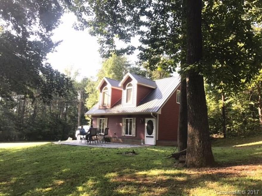 More than charming! Waterview home on .9 acre corner lot across from lake. Immaculate, well appointed property made for a couple's residence or vacation getaway. An oversized garage and a stamped concrete patio in quiet area with mature trees, this home will get you to lake at good price. New Catawba Mtn Creek Park, 589 acres, nearby. All major appliances included. This is opportunity to enjoy the lake while new amenities of Sherrills Ford Village, including the new Publix grocery, are close by.