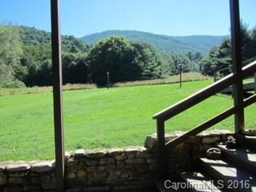 AWESOME VIEW AND 2 BOLD CREEKS! Gentle to moderate laying land - this is really a prize tract of land! It is a raised ranch with a partial basement workshop underneath. The kitchen has Kraftmaid cabinets with roll out shelves. Dining room has a built in buffet equipped with electricity. Spacious front porch and fire-pit area outside for taking in the great view! Cane Creek flows inside the west side of the property and Soap Stone Branch is the boundary on the other long side.
