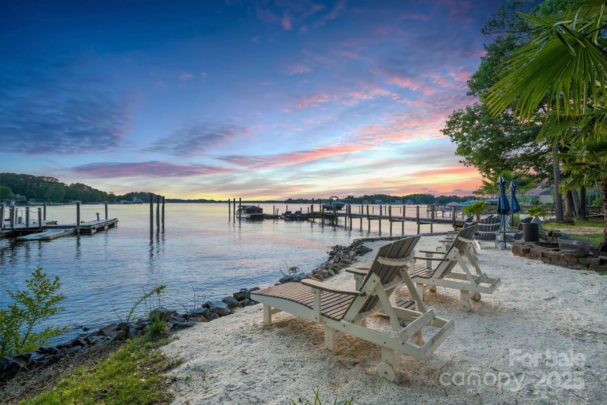 Exclusive offer: Seller to transfer their Full Peninsula Club Golf Membership with an accepted offer, bypassing the 5-year waitlist! This rare Lake Norman gem offers 4,000 sq ft of luxury living with a 3-car garage and jaw-dropping main channel sunset views, tucked inside the prestigious Peninsula area without the HOA dues or restrictions. Recently transformed by a nearly $750,000 renovation, this home is flawless in size, style & location. Teaser features include $75K White Oak flooring & new stairs, $50K KS Audio Smart Home & surround sound system, Mother of Pearl & marble tile flooring, a custom modern see-through wine rack, built-in espresso machine, $21K great room chandelier, $10K foyer chandelier, $36K in custom metal doors, a striking custom marble fireplace, all new renovated bathrooms & a showroom-worthy marble-finish garage floor. 2 new water heaters, 1 new HVAC, & more. The real showstopper? The kitchen with a $65K Lilac Calacatta marble island, countertop & backsplash, it is simply stunning! Homes like this rarely come to market—request the complete renovation list & schedule your private showing today!