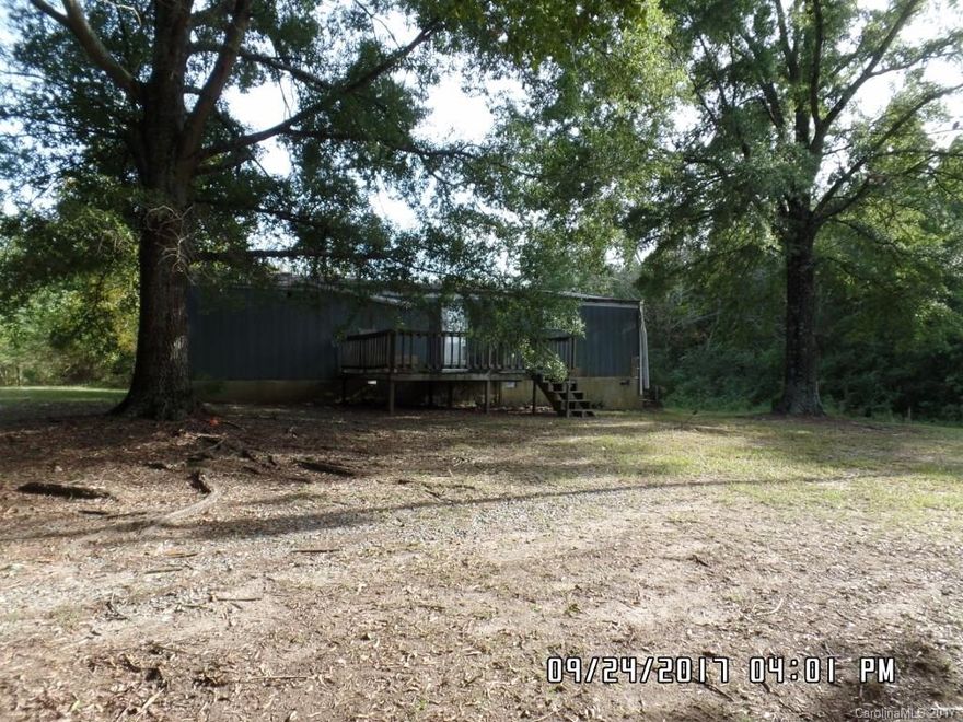 Three bedroom, 2 bath double wide mobile home in need of repair.  Use back door only, do not access via front deck, Use caution in kitchen.  Nice lot with several large trees.
.