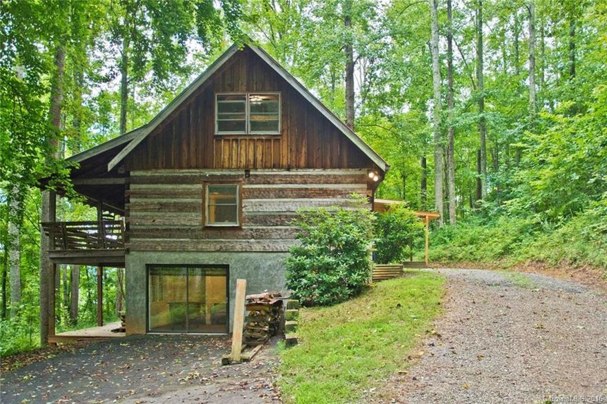 NEW KITCHEN!!  Moving to Western North Carolina?  Want a log cabin  in the woods with a mountain feel and still be to downtown Asheville in minutes?  Looking for a vacation rental that is already established on AirBnB. Prehaps you just want to cuddle up by the wood stove and watch the snow fall or rock on the covered front porch and listen to the night sounds. Maybe you want a retreat to write that new book. If you have ever thought about a log cabin then this is your house. Hurry call today!