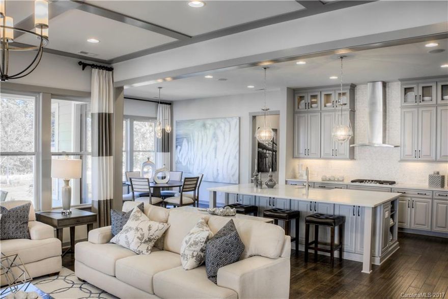 The Harmony plan is a 5 bed/ 4.5 bath owners up, with a delightful Craftsman exterior. 10ft ceilings on the 1st floor w/ an oversized 2 car garage, an extended outdoor living area. As you enter this open floor plan, you will find a formal dining area with tray ceilings & a study/office. The spacious great room includes a fireplace & opens to the casual dining room and kitchen. The kitchen includes quartz  & Granite counters, with beautiful cabinetry and a large island. Guest room on main level.