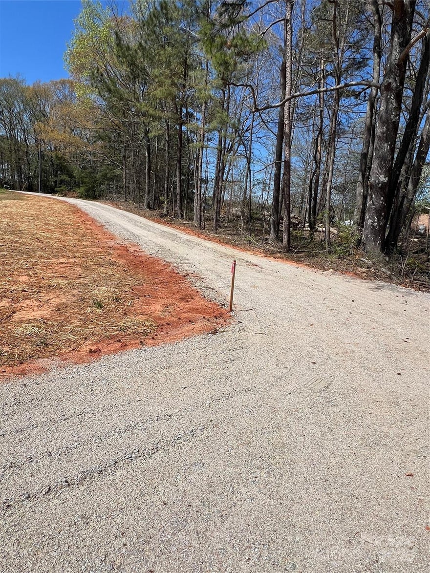 Back on the market - Buyer backed out. Mobile home approved. Build your dream home or invest in this beautiful, level lot in the desirable Buford School District in Lancaster SC. With the land cleared & padded out, the driveway installed, county water available & septic permit on file, this property is ready to be developed. Tap fees & septic install are the buyer’s responsibility. Homeowners & builders alike, this lot offers great potential. Situated in a private country setting, you’ll enjoy peace & quiet while enjoying the tranquility of the surrounding trees & nature. A nature lover’s paradise w/tons of wildlife. Prepare to fall in love with this property! Whether creating your own Private Estate, Retreat or Hobby Farm. This IS the perfect place to call home! Manufactured & Modular home, Stick build, Barndominium & Tiny Home approved. Easy access to all that Lancaster has to offer, including shopping, dining, & medical facilities.
