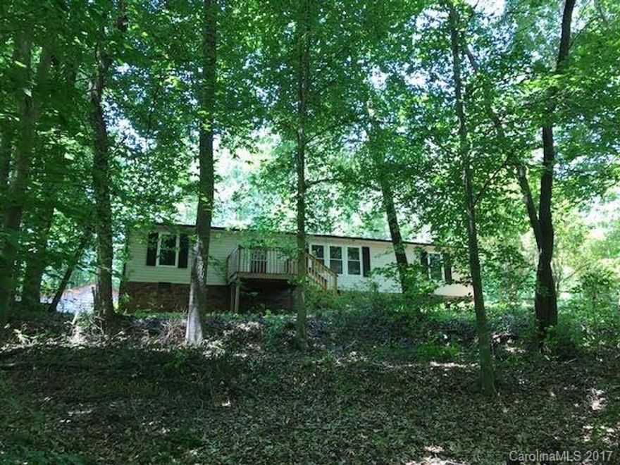 ONE OF A KIND! Beautifully renovated home nestled in 2.24 secluded wooded acres. Private and serene. Large outbuilding with shop, storage, and car shed. Open floor plan. New flooring and carpet, new paint throughout, new heat pump, new low-e double paned windows. Deck overlooking woods and brook. Close to Hwy 16, easy commute to Charlotte, Mooresville, Lincolnton, Hickory. A MUST SEE! Hurry, won't last long!