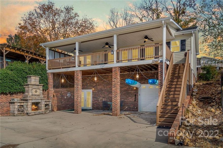 Enjoy the nice breeze & lake views from the covered porch of this 3-bedroom 2 1/2 bath Modular Home located inside the gated lakefront community of Badin Shores Resort. This home offers 2 bedrooms, 1 1/2 bath with open concept kitchen, dinning & den area upstairs. Downstairs offers 1 bedroom, 1 bath, and a nice garage to store all your lake toys. The curb appeal will reel you into see the home, but you will not want to leave once you see the lake view and the updated interior.  This property comes with outdoor fireplace and great parking for all your cars, trucks, golf carts, and boat. The resort offers many amenities that include pool, beach area, restaurant, club house, playground, boat ramp, putt putt, basketball courts, and waterfront boardwalk.