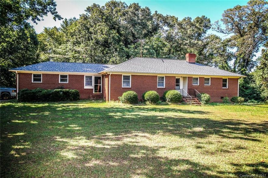 GREAT LOCATON. All brick ranch w/walk-out basement in highly sought after area of Union County. Home is located on 1.25 acre wooded flat lot. Beautiful hardwood flooring, windows and other updating within 10 years. Architectural roof 2014, Water Heater 2017.  Breezeway/enclosed porch between house and garage. Great investment property.   Great schools, convenient to 485, Rea Rd & Providence. Huge basement/interior entrance.