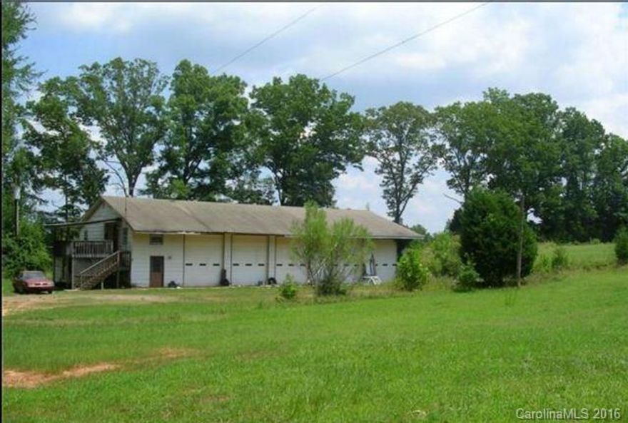 Excellent warehouse space for storage!  Unique property has a 5 bay garage approximately 40x70 situated on a large 5 acre lot with apartment on second level.  One bedroom, one bath, living room and kitchen. Estate sale with limited knowledge. Well will have to be drilled for this property and seller is willing to install with reasonable offer. Age is approximate.