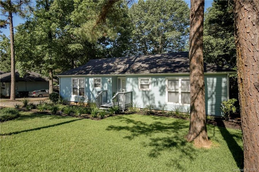 Tega Cay Ranch Home located on a Rare Flat lot includes large entertaining deck and Fenced in Yard.  Beautiful Landscaping buyers are looking for.  Kitchen includes refrigerator and bright lovely In-Eat Breakfast area. Large Family Room/Dining combo with Fireplace and built-ins.