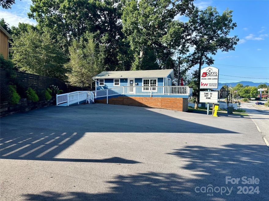 Excellent In-Town Location, just off I-26 Exit and Four Seasons Blvd in Hendersonville, across the street from Starbucks. Charming retail location with 640 sq' heated space on full height crawl space used for storage. Building and property is in excellent condition and ready for move in. Bldg has ramp and stair access with wrap around deck and glass doors with long range views of Four Seasons Blvd and distant mountain views. Bldg was recently remodeled with new bathroom and new kitchen featuring all new cabinetry, beverage refrigerator, dual sink, lots of cabinet storage, new window coverings and connected to city water and sewer. Recently paved parking deck for approx. 8 to 10 cars, decorative fencing and landscaping, and large lighted signage available to re-branding. Would make an excellent retail/office location for insurance, real estate or other comparable uses. This is an excellent location with visibility to Four Seasons Blvd at a reasonable price. Come check it out today!