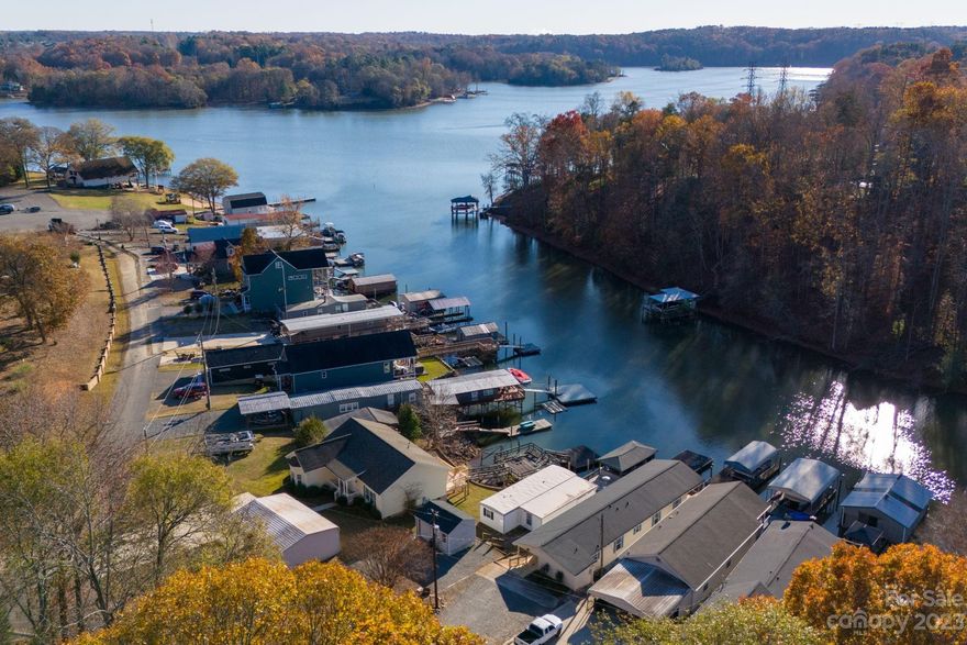 What can only be described as one of the last & rarest affordable opportunities to own a waterfront home on the beautiful shores of Lake Wylie, North Carolina. Featuring Two bedrooms & two full bathrooms, large laundry room, living room and covered front and rear porch’s. A pier that leads to your covered floating dock with deep water! All of this located in the gated & private Gaston County Wildlife Club featuring community boat ramp, community clubhouse, boat storage, and the list goes on. This property is going to require a cash buyer as you are buying the home and the club owns all land! No deed but title insurance is available! Ownership is dependent on private clubs approval and $600 per year HOA lease fee! A rare opportunity to live on the water full time or have an amazing getaway at the cost of most waterfront lots! Just minutes from downtown Belmont, incredible dining, shopping, and Charlotte Douglas International Airport! 3155 South Point Rd. Belmont, NC!