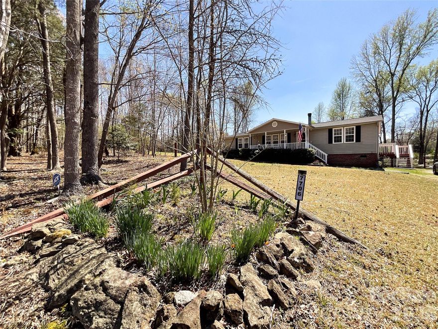 Welcome to your dream home in Waxhaw !! This charming residence perfectly blends elegance with mordern comfort. Step inside to luxury Vinyl Plank flooring that flows seamlessly through the kitchen and living room. The heart of the home is the stunning kitchen, featuring a sophisticated electric range with hood, a convection oven, and other LG appliances that all convey with the home. The centerpiece is the waterfall granite countertop w/ an eight foot island ideal for entertaining. Adjacent to the kitchen , enjoy evenings beside the wood burning fireplace in the light filled living area perfect for relaxing with family and friends. Both bathrooms have been beautifully remodeled, boasting elegant tiled showers for a spa-like experience. This wonderful home has three gorgeous acres of peaceful and privacy living but only minutes from Waxhaw, Monroe and Lancaster for all your shopping and dining adventures. 
A wonderful opportunity to own your on retreat.
The 3.18 acres has two parcel id numbers:   05-101-007-F  and  05-101-008-A.