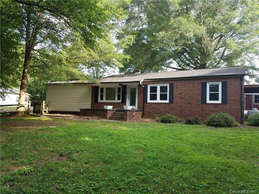 Solid brick ranch on beautifully landscaped, 1.29 acre lot. Huge block building plus additional storage buildings. Master suite has garden tub and Walk in closet. Unigue private master outdoor retreat is partially covered with hot tub, sauna and outdoor shower. HW floors, replacement windows and lots of updates. Private yard but convenient location near downtown Taylorsville.